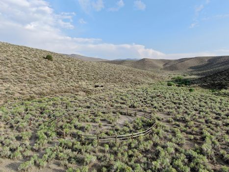 Aerial view of old wood ranch in the middle of the desert valley in Lee Vining, California, USA