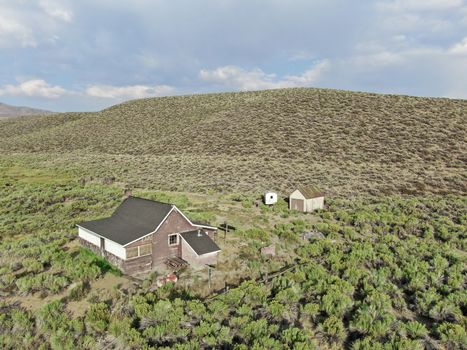 Aerial view of old wood ranch in the middle of the desert valley in Lee Vining, California, USA