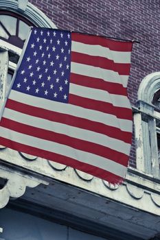 American flag in front of colonial style building