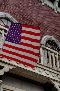 American flag in front of colonial style building