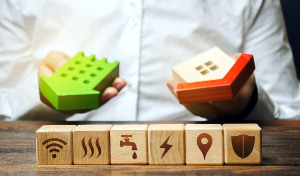 Real estate buyer chooses best option and blocks with communal services symbols attributes. Utilities public service. Choosing most economical housing. Reducing costs, saving energy, natural resources