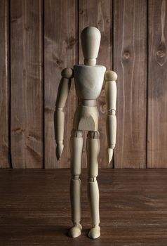 A mannequin on a wooden surface