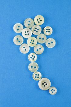 White buttons on blue background ,various buttons put in a ballon shape 