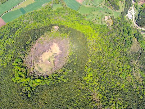 The Santa Margarida Volcano is an extinct volcano in the comarca of Garrotxa, Catalonia, Spain. The volcano has a perimeter of 2 km and a height of 682 meters in Garrotxa Volcanic Zone Natural Park