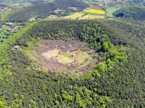 The Santa Margarida Volcano is an extinct volcano in the comarca of Garrotxa, Catalonia, Spain. The volcano has a perimeter of 2 km and a height of 682 meters in Garrotxa Volcanic Zone Natural Park