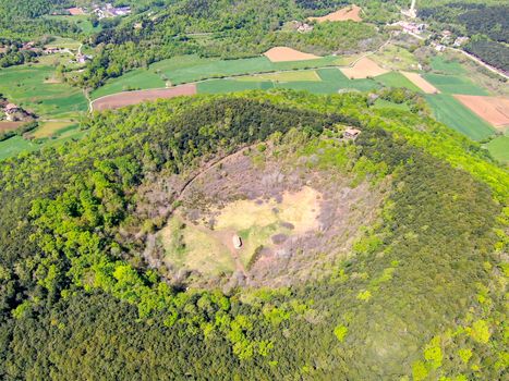 The Santa Margarida Volcano is an extinct volcano in the comarca of Garrotxa, Catalonia, Spain. The volcano has a perimeter of 2 km and a height of 682 meters in Garrotxa Volcanic Zone Natural Park