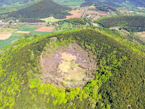 The Santa Margarida Volcano is an extinct volcano in the comarca of Garrotxa, Catalonia, Spain. The volcano has a perimeter of 2 km and a height of 682 meters in Garrotxa Volcanic Zone Natural Park