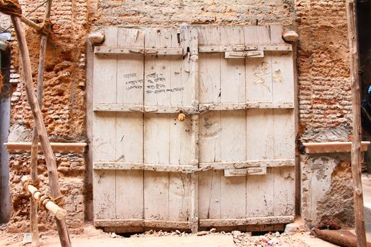 locked broken gate of old ruined house in chandini chowk