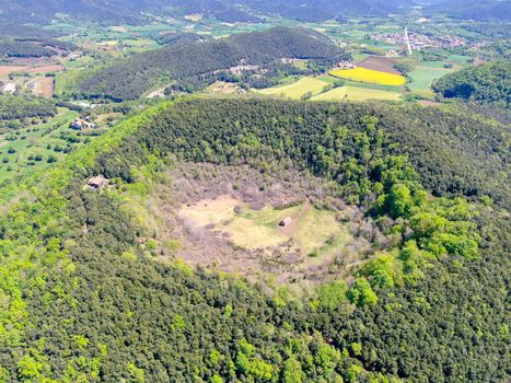 The Santa Margarida Volcano is an extinct volcano in the comarca of Garrotxa, Catalonia, Spain. The volcano has a perimeter of 2 km and a height of 682 meters in Garrotxa Volcanic Zone Natural Park