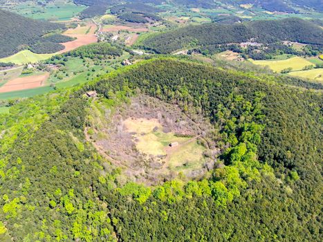 The Santa Margarida Volcano is an extinct volcano in the comarca of Garrotxa, Catalonia, Spain. The volcano has a perimeter of 2 km and a height of 682 meters in Garrotxa Volcanic Zone Natural Park