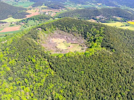 The Santa Margarida Volcano is an extinct volcano in the comarca of Garrotxa, Catalonia, Spain. The volcano has a perimeter of 2 km and a height of 682 meters in Garrotxa Volcanic Zone Natural Park