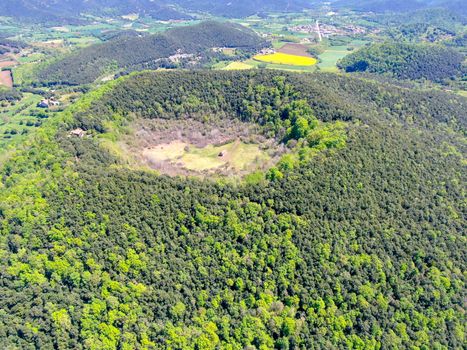 The Santa Margarida Volcano is an extinct volcano in the comarca of Garrotxa, Catalonia, Spain. The volcano has a perimeter of 2 km and a height of 682 meters in Garrotxa Volcanic Zone Natural Park