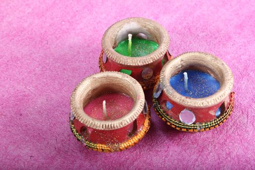 three beautifully decorated candle pot