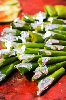 Prepared and decorated Betel leaves (Piper Betle). Betel leaves are mixed with ground nuts and optionally tobacco. Also called Paan, is popular across India as mouth freshener.