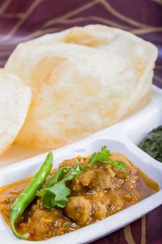 chole bhature with green chilie topping