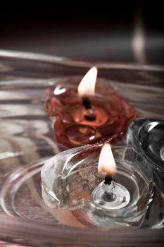 floating burning candles in glass aroma bowl - vintage