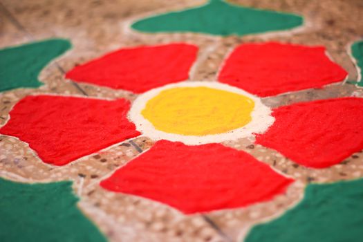 rangoli handiwork design using coloured stone powder