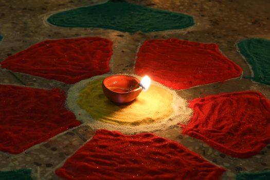 deepak with colorful rangoli