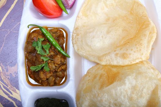 spicy chole bhautre, with green chili topping
indian dish