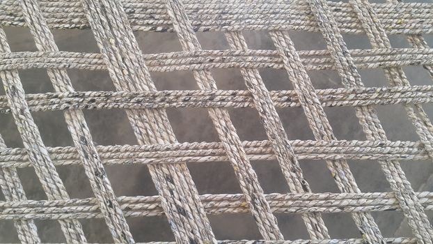 Closeup view of dried jute thread or ropes interwoven for making traditional old style bed called charpai