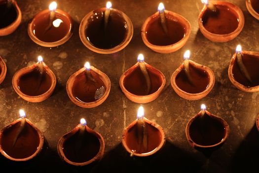 Indian traditional festival of oil lamp symbolizing spreading of light and end of darkness