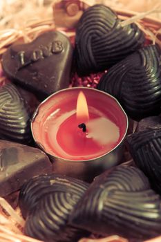 candle at center of home made chocolates - retro style