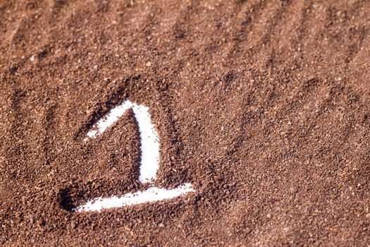 one number draw on cocoa powder, white background