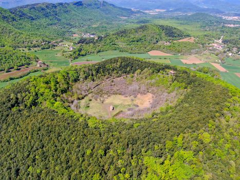 The Santa Margarida Volcano is an extinct volcano in the comarca of Garrotxa, Catalonia, Spain. The volcano has a perimeter of 2 km and a height of 682 meters in Garrotxa Volcanic Zone Natural Park