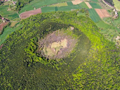 The Santa Margarida Volcano is an extinct volcano in the comarca of Garrotxa, Catalonia, Spain. The volcano has a perimeter of 2 km and a height of 682 meters in Garrotxa Volcanic Zone Natural Park