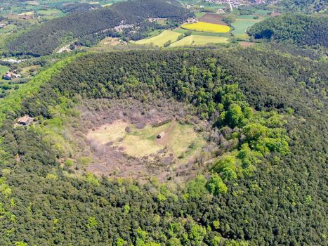 The Santa Margarida Volcano is an extinct volcano in the comarca of Garrotxa, Catalonia, Spain. The volcano has a perimeter of 2 km and a height of 682 meters in Garrotxa Volcanic Zone Natural Park