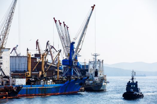 Summer, 2016 - Vladivostok, Russia - Vladivostok Sea Port. Commercial coasters are loading at the commercial port of Vladivostok.