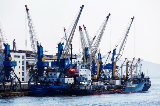Summer, 2016 - Vladivostok, Russia - Vladivostok Sea Port. Commercial coasters are loading at the commercial port of Vladivostok.