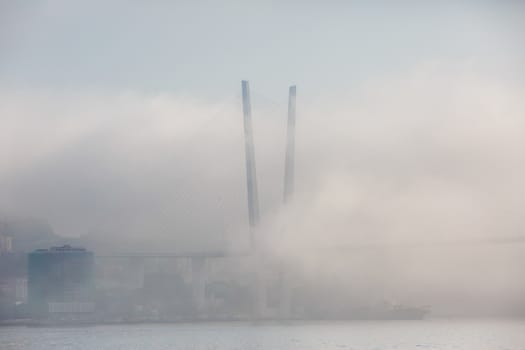 The Golden Bridge in Vladivostok is shrouded in thick fog