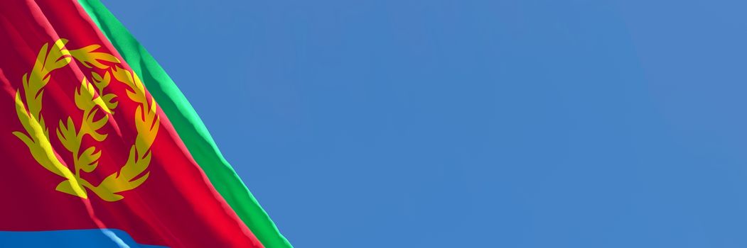 3D rendering of the national flag of Eritrea waving in the wind against a blue sky