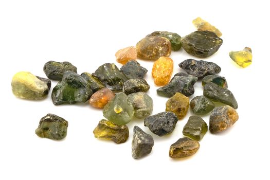 A collection of uncut natural sapphires isolated on a white background