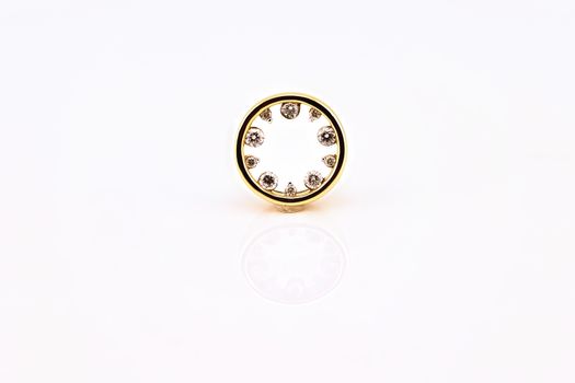 A circle of diamonds pendant set in yellow gold, isolated on a white background