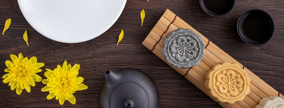 Colorful beautiful moon cake, mung bean cake, Champion Scholar Pastry cake for Mid-Autumn festival traditional gourmet dessert snack, top view, flat lay.