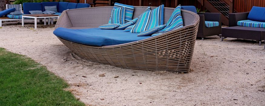 Beach chairs for lounging on the sand and relaxing outdoors by the coast