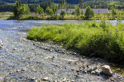 Flowing beautiful river lake Hemsila in Hemsedal, Viken, Buskerud, Norway.