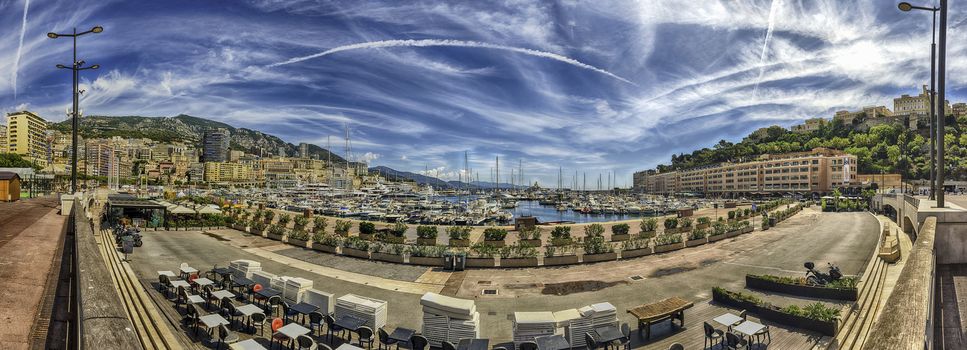 Panoramic view over luxury yachts and apartments of Port Hercules in La Condamine district, city centre and harbour of Monte Carlo, Cote d'Azur, Monaco, iconic landmark of the French Riviera