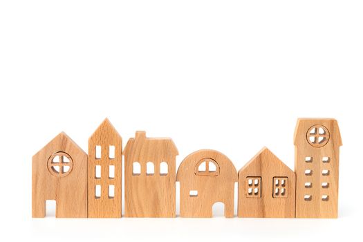 Wooden house model on white background for housing and property concept