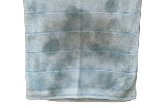 Old towel with stains on white background