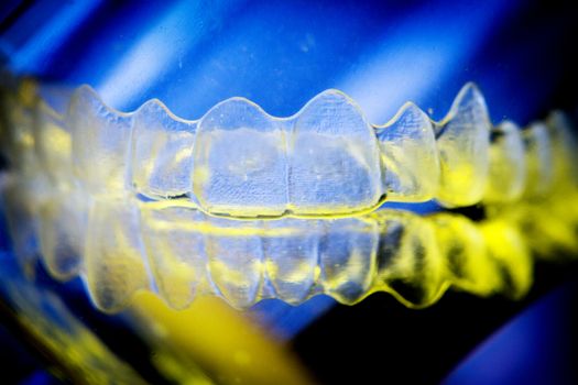 Invisible dental orthodontic submerged in water for cleaning