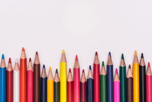 Colour pencils, colored pencils lay in a heap, school design, items for school design, colored flat education tools, copyspace