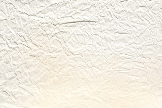 Crumpled old pale brown paper background texture