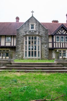 A Detailed and Ornamental Cobblestone Building With a Red Roof