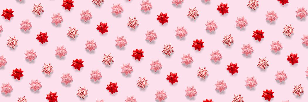 modern christmas background on pink backdrop. creative flat lay for christmas time, banners, posters, prints and other creative works. not seamless pattern