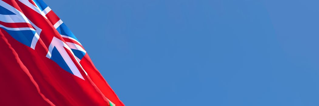 3D rendering of the flag of Bermuda waving in the wind against a blue sky