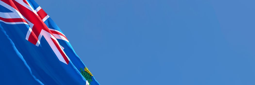 3D rendering of the national flag of Cayman Islands in the wind against a blue sky