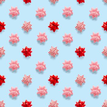 Seamless regular creative Christmas pattern with New Year decorations on blue background. xmas Modern Seamless pattern made from christmas decorations. Photo quality pattern for fabric, prints, wallpapers, banners or creative design works.